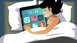 Internet zavisnost: žena u krevetu sa tabletom